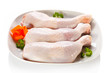 Photo: Raw chicken legs on white background Raw chicken legs on white background