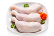 Photo: Raw chicken legs on white background Raw chicken legs on white background