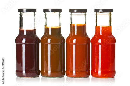 Photo: various barbecue sauces in glass bottles various barbecue sauces in glass bottles