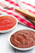 various barbecue sauces in ceramic bowls