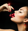 Photo: Sexy Woman Eating Cherry. Sensual red Lips with Cherries Sexy Woman Eating Cherry. Sensual red Lips with Cherries