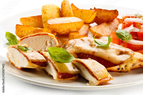 Photo: Grilled chicken breasts with cheese and baked potatoes Grilled chicken breasts with cheese and baked potatoes