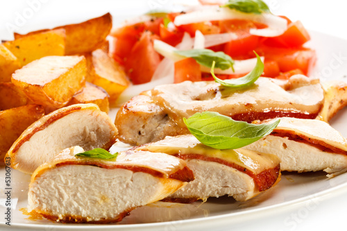 Photo: Grilled chicken breasts with cheese and baked potatoes Grilled chicken breasts with cheese and baked potatoes
