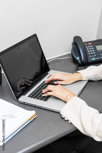 Photo: Hands typing on laptop keyboard Hands typing on laptop keyboard