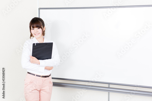 Photo: beautiful asian teacher in the classroom beautiful asian teacher in the classroom