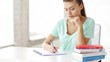 pretty female student doing homework