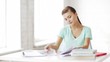 pretty female student doing homework