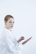 Casual Young Woman with Digital Tablet in Showcase Home