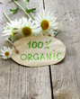 organic label with daisies on natural background
