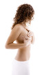 Woman examining her breast isolated on white background