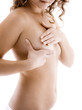 Woman examining her breast isolated on white background
