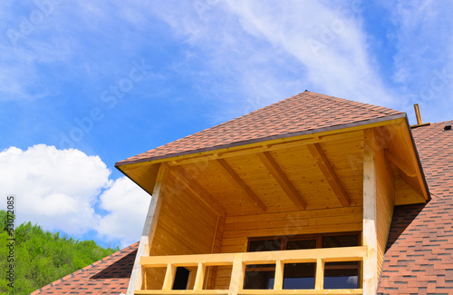 Photo: Dormer with a balcony on top of a house Dormer with a balcony on top of a house