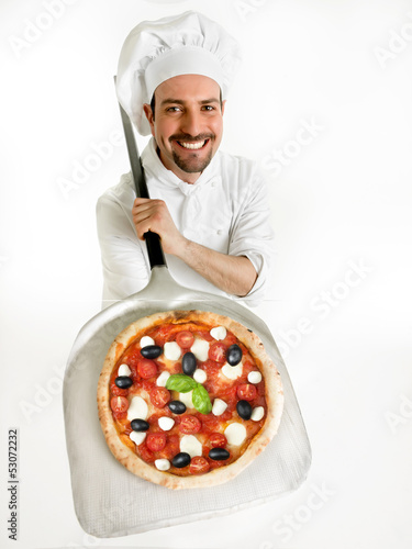 Photo: chef shows his delicious pizza on the shovel chef shows his delicious pizza on the shovel