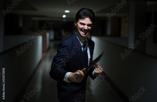 Photo: The killer in a suit with a knife The killer in a suit with a knife