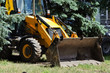 Big yellow tractor with a bucket
