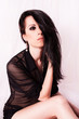 Beautiful young woman with make-up and long hair.