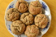 Rye muffins in a plate on a wooden table