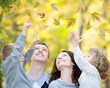 Happy family in autumn park