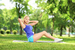 Young woman exercising in a park
