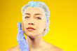 Beauty woman giving botox injections. studio