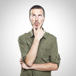 Portrait of handsome young thoughtful man isolated over white ba