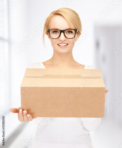 Photo: woman with cardboard box woman with cardboard box