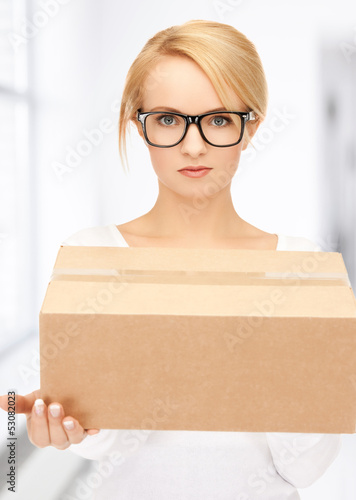 Photo: woman with cardboard box woman with cardboard box