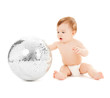 child playing with disco ball