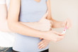 woman and man hands with pregnancy test