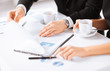 woman hand signing contract paper