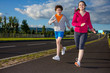 Healthy lifestyle - girl and boy running, jumping outdoor