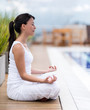 Woman meditating outdoors