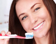 Photo: Cute woman clean teeth Cute woman clean teeth