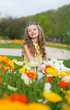 Girl with beautiful orange and yellow poppies
