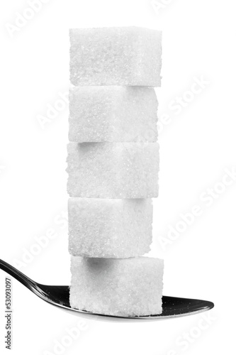 Photo: cube sugars in teaspoon isolated on white cube sugars in teaspoon isolated on white