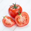 Photo: Vegetables: ripe tomatoes on wooden boards Vegetables: ripe tomatoes on wooden boards