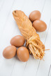 Photo: Smoked cheese and brown chicken eggs, vertical shot Smoked cheese and brown chicken eggs, vertical shot