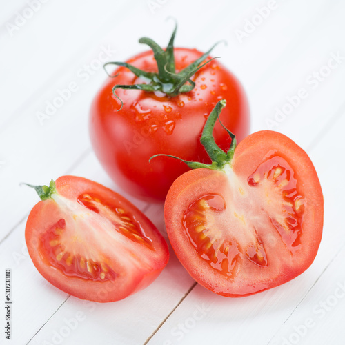 Photo: Vegetables: ripe tomatoes on wooden boards Vegetables: ripe tomatoes on wooden boards