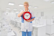 Mature doctor with clock