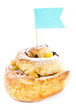Rolled cake with cinnamon and card with message isolated on whit