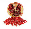 Juicy pomegranate fruit with seeds isolated against white