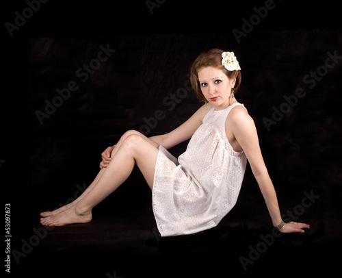 Photo: A girl in a white dress A girl in a white dress