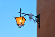 street lamp on the wall in the evening