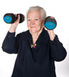 Happy old woman making fitness training with dumbbells