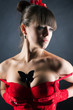 Girl in sexy red corset with butterfly