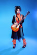 Rock girl posing with electric guitar playing hard-rock isolated