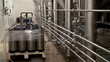 Filling (packaging) fresh beer in a beer kegs at a brewery.