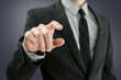 Photo: Businessman touching empty virtual screen Businessman touching empty virtual screen