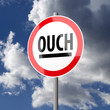 Road sign White Red with word Ouch