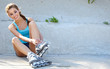 Roller girl resting on the steps